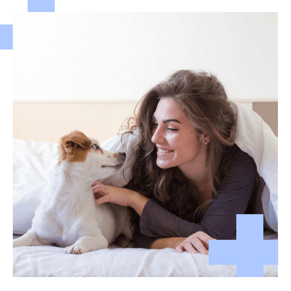 Woman and dog in bed